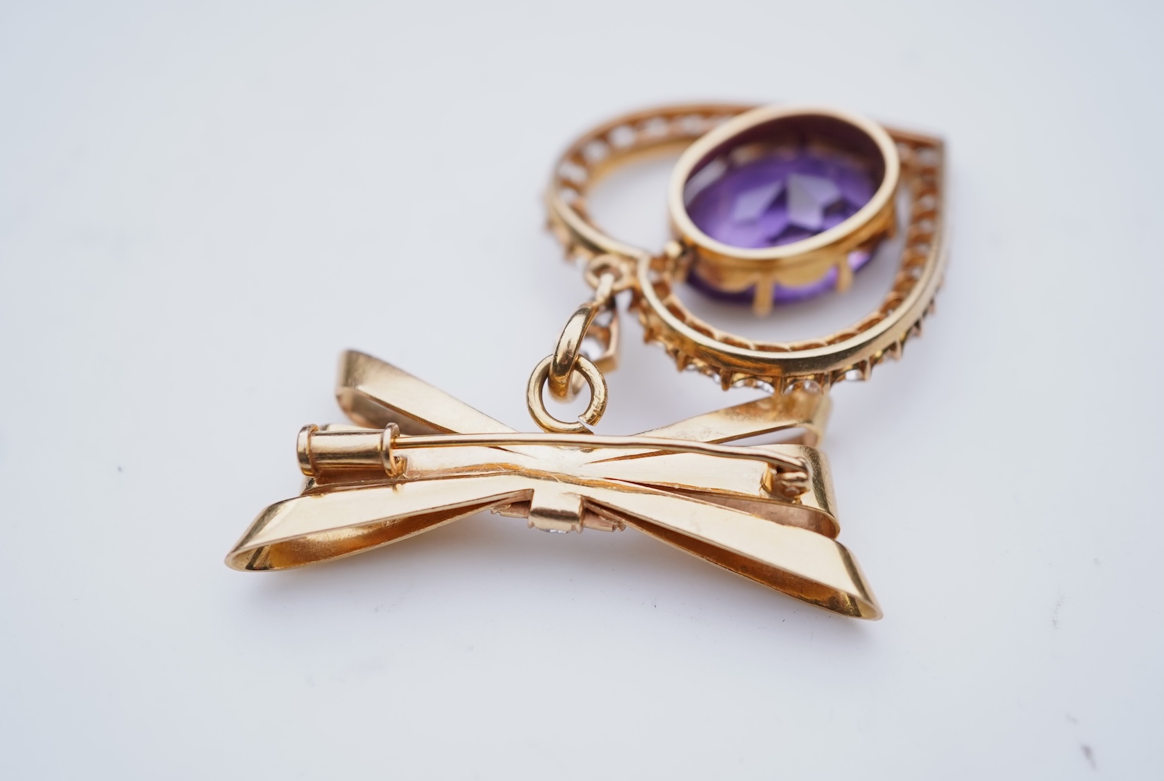 A synthetic sapphire and diamond pendant, mid 20th century